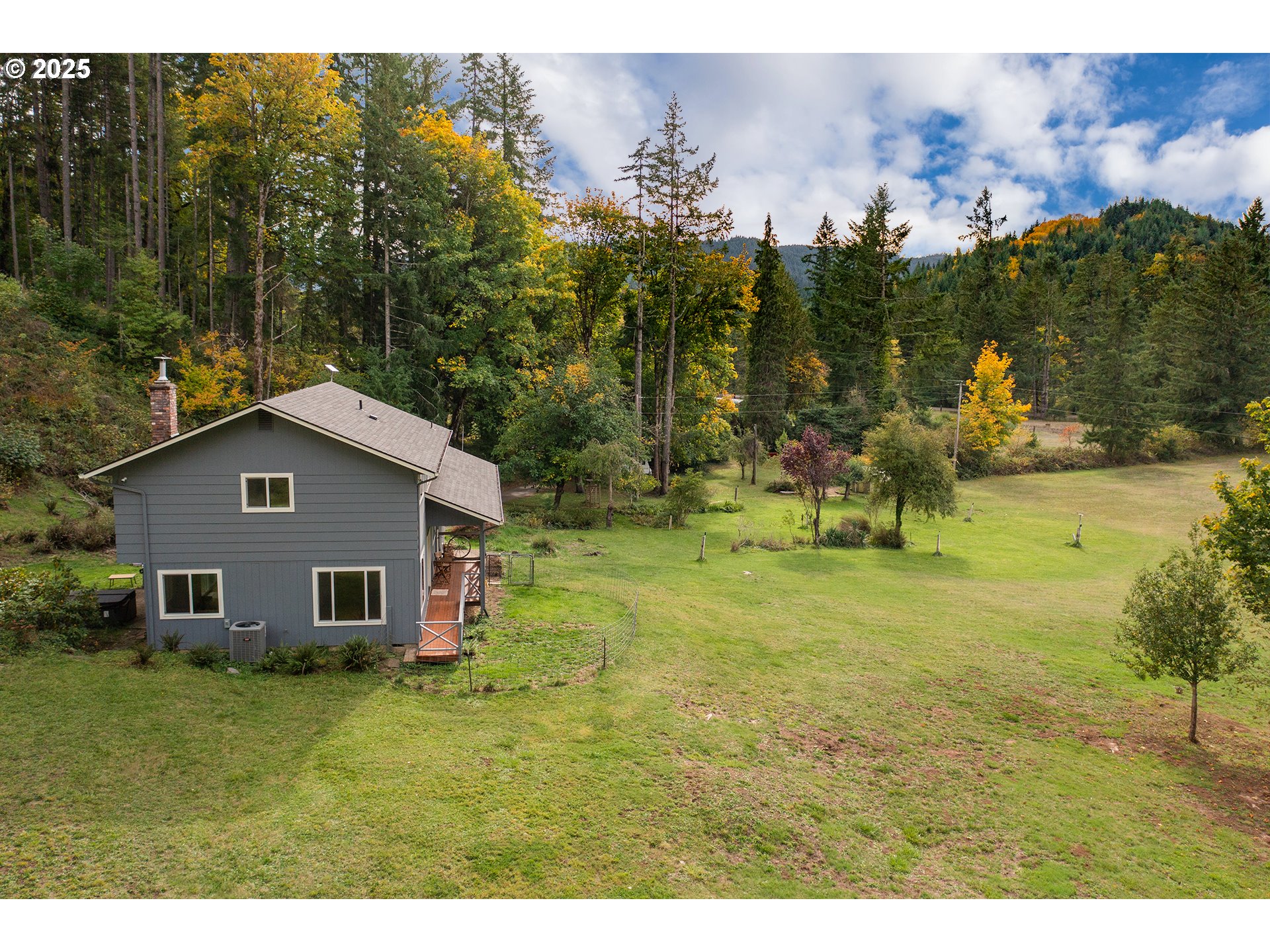 76377 Mosby Creek Road Cottage Grove, OR 97424 - Photo 46 of 48 a view of a house with a yard