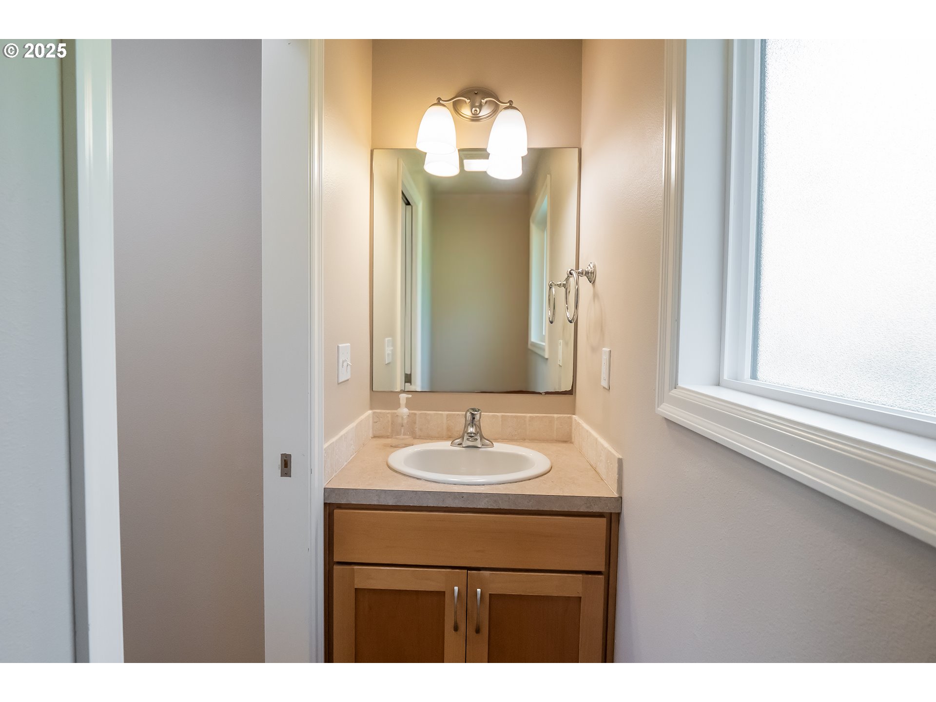 76377 Mosby Creek Road Cottage Grove, OR 97424 - Photo 10 of 48 a bathroom with a sink and a mirror