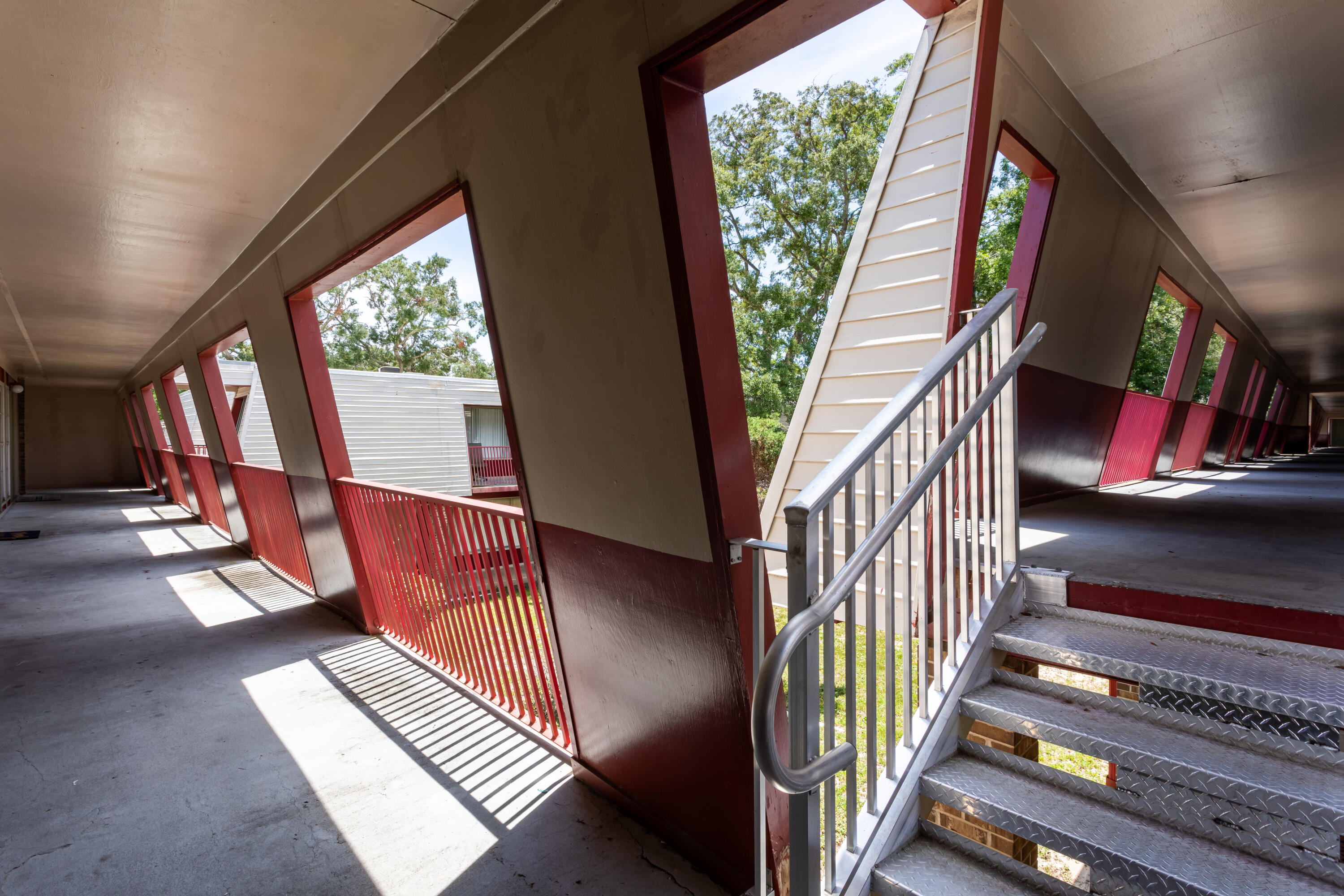 210 Pelham Road, Unit 209A Fort Walton Beach, FL 32547 - Photo 17 of 19 a view of an entryway with wooden floor and door