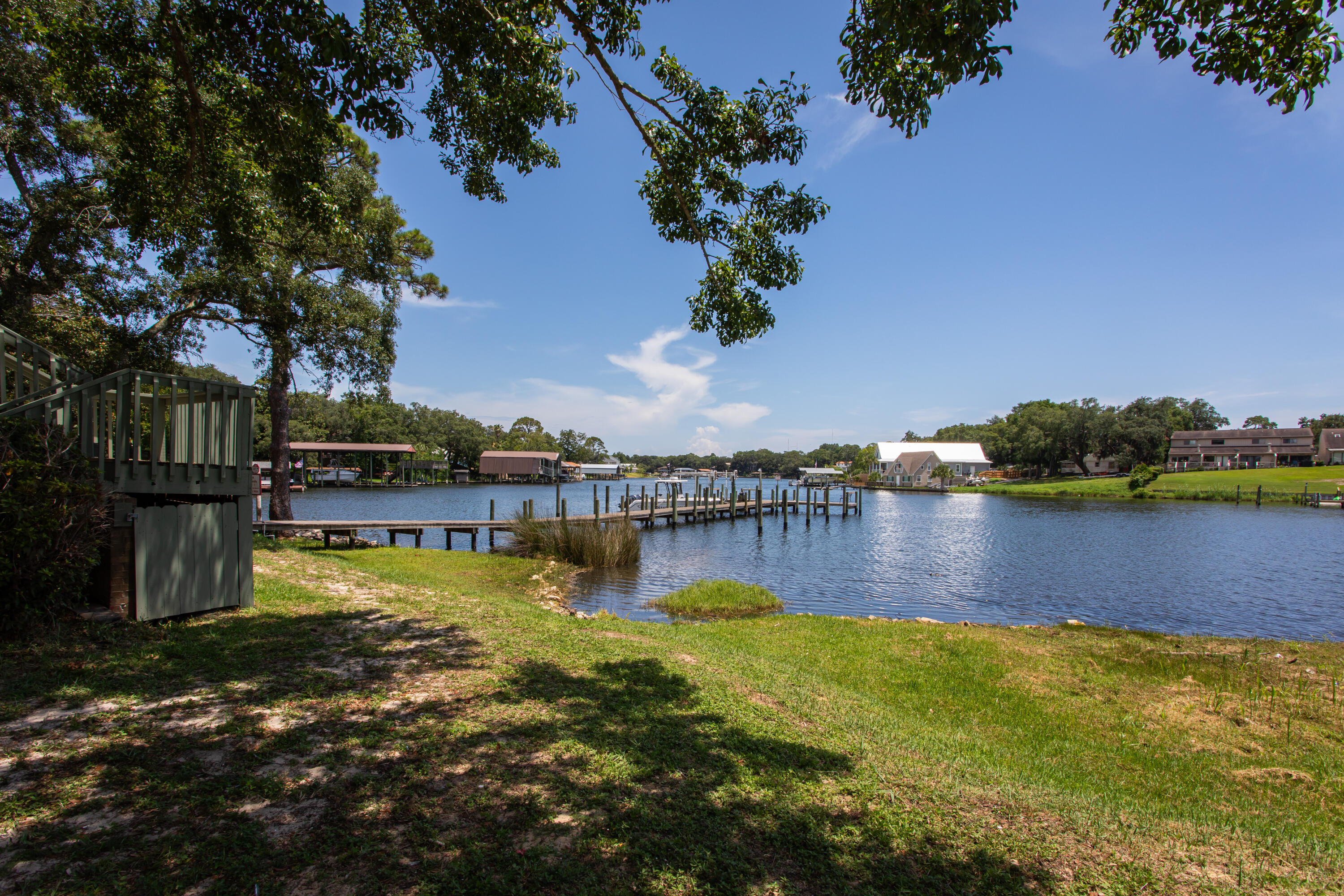 210 Pelham Road, Unit 209A Fort Walton Beach, FL 32547 - Photo 18 of 19 a view of a lake with houses