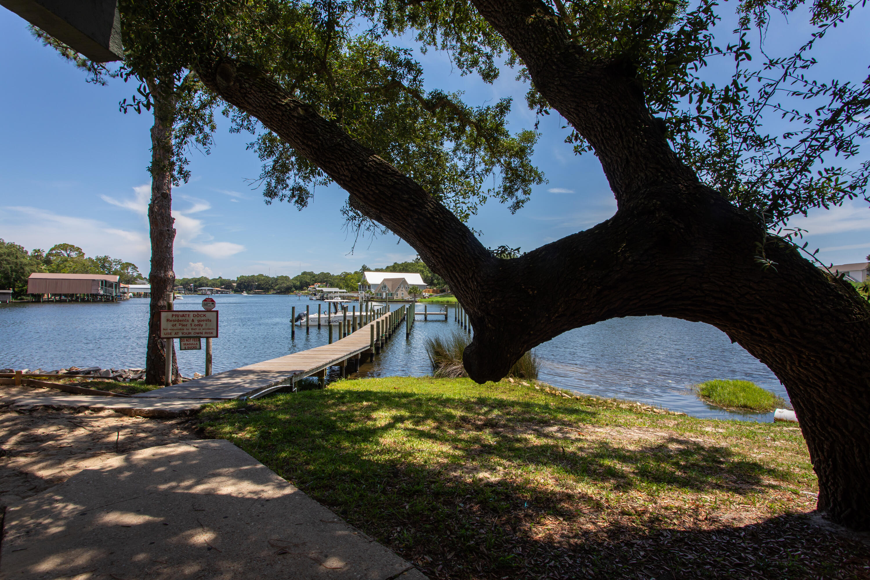210 Pelham Road, Unit 209A Fort Walton Beach, FL 32547 - Photo 2 of 19 a view of a backyard of the house