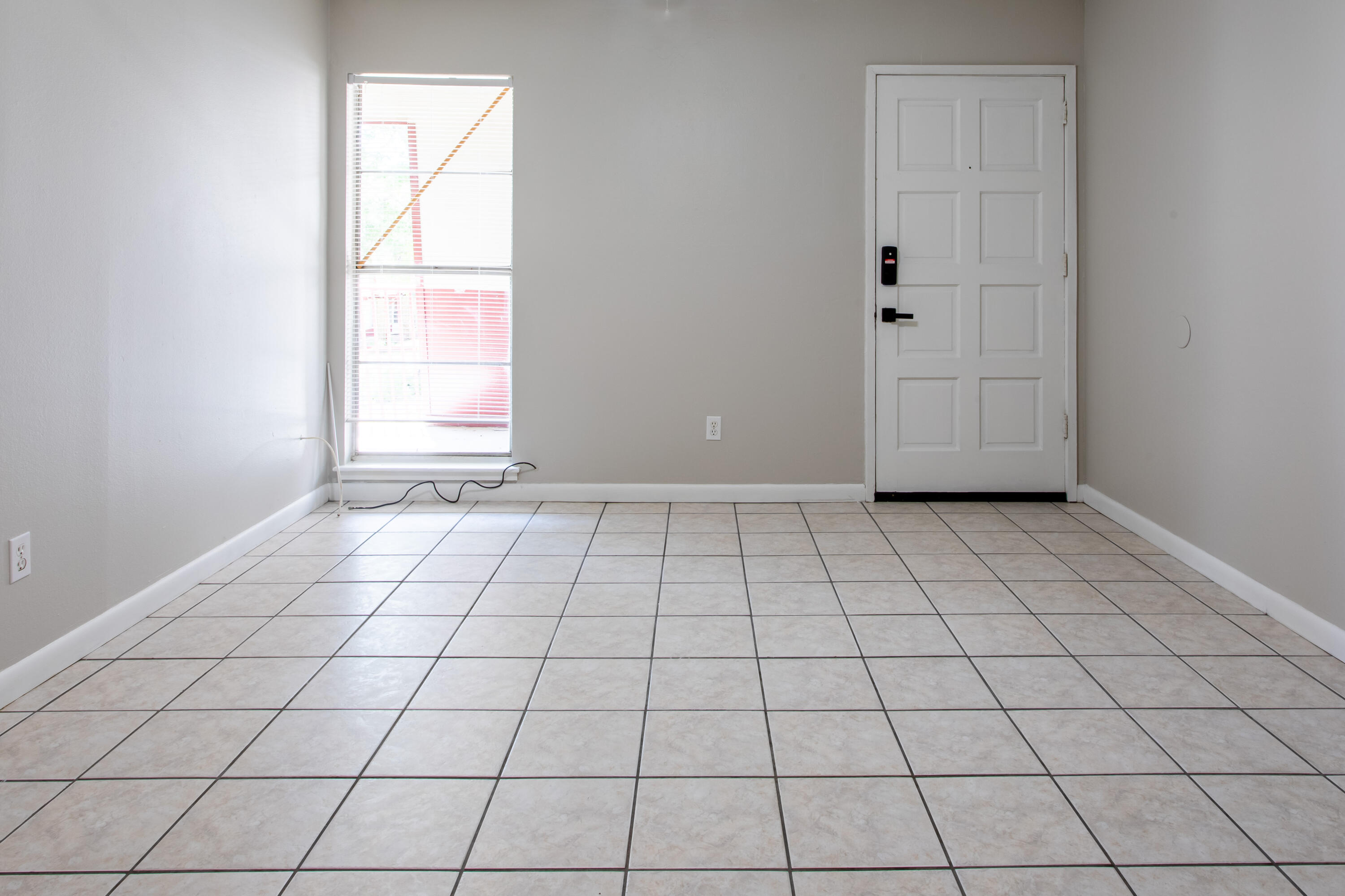 210 Pelham Road, Unit 209A Fort Walton Beach, FL 32547 - Photo 4 of 19 a view of an empty room and window