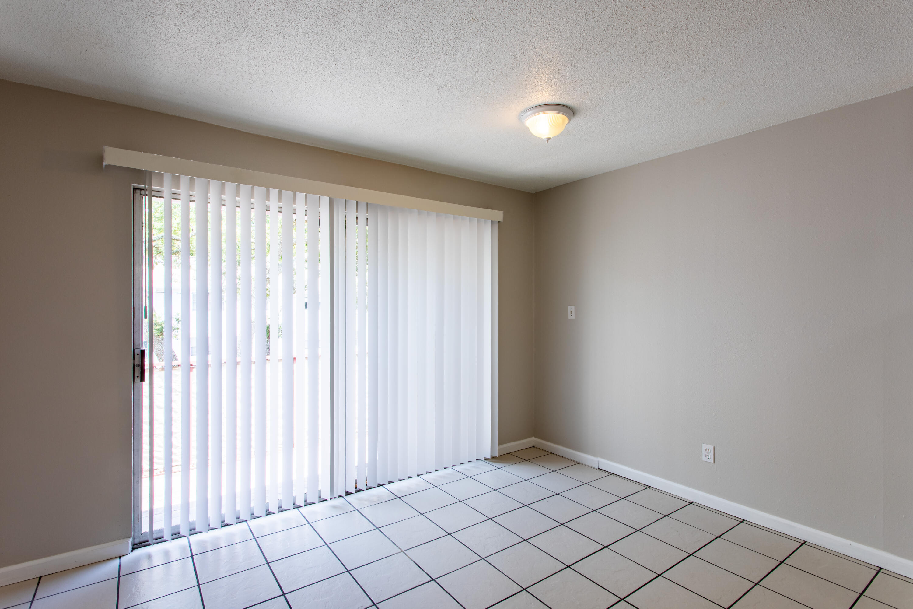 210 Pelham Road, Unit 209A Fort Walton Beach, FL 32547 - Photo 6 of 19 an empty room with windows