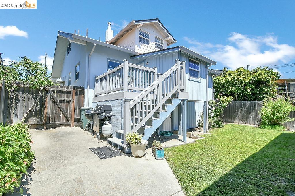 325 South 2nd Street Rio Vista, CA 94571 - Photo 32 of 33 Rear exterior with a multi-level deck featuring painted wood railings and stairs