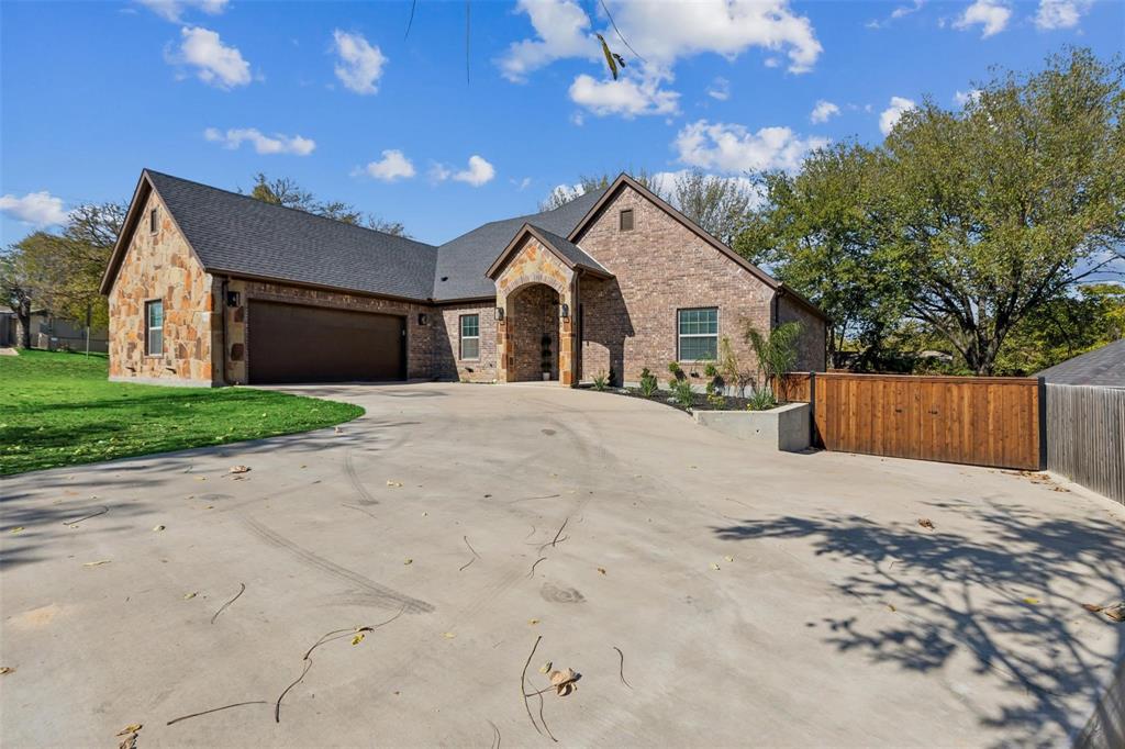 4662 Barbara Road River Oaks, TX 76114 - Photo 1 of 14 Brick and stone exterior with a dark shingle roof