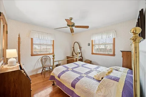 a bedroom with bed and a window