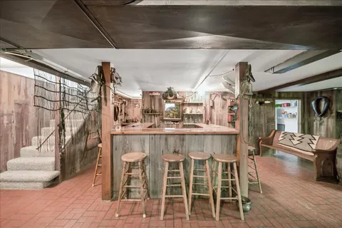 a dining room with furniture and wooden floor