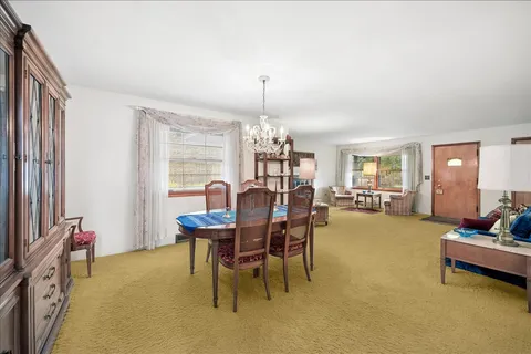 a outdoor space with furniture and a chandelier