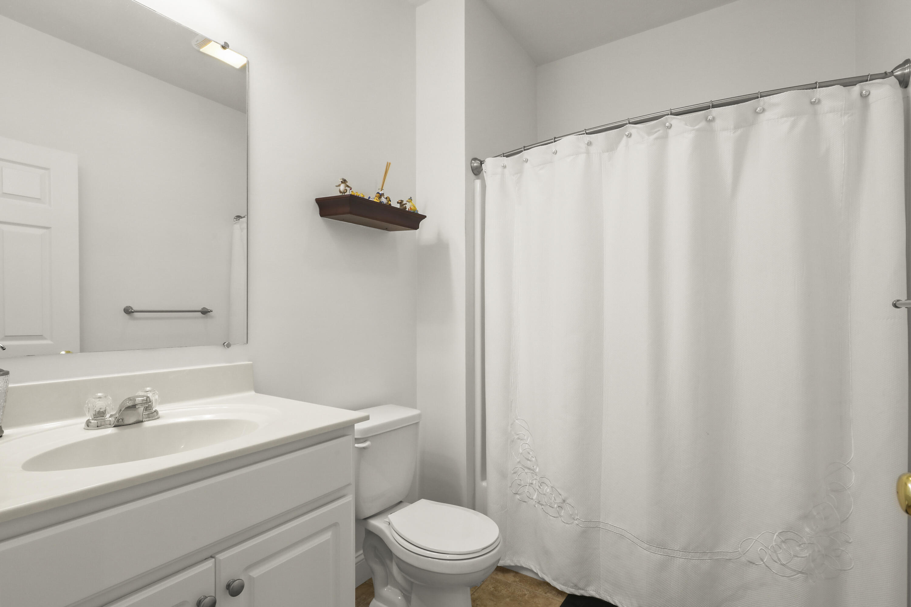 21 Grey Hawk Drive, Unit 21 Mashpee, MA 02649 - Photo 12 of 34 a bathroom with a sink and a mirror