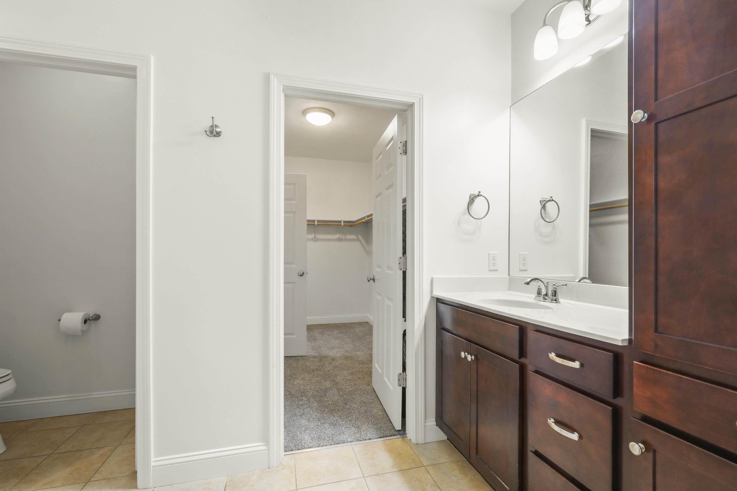 21 Grey Hawk Drive, Unit 21 Mashpee, MA 02649 - Photo 16 of 34 a bathroom with a double vanity sink and mirror with shower