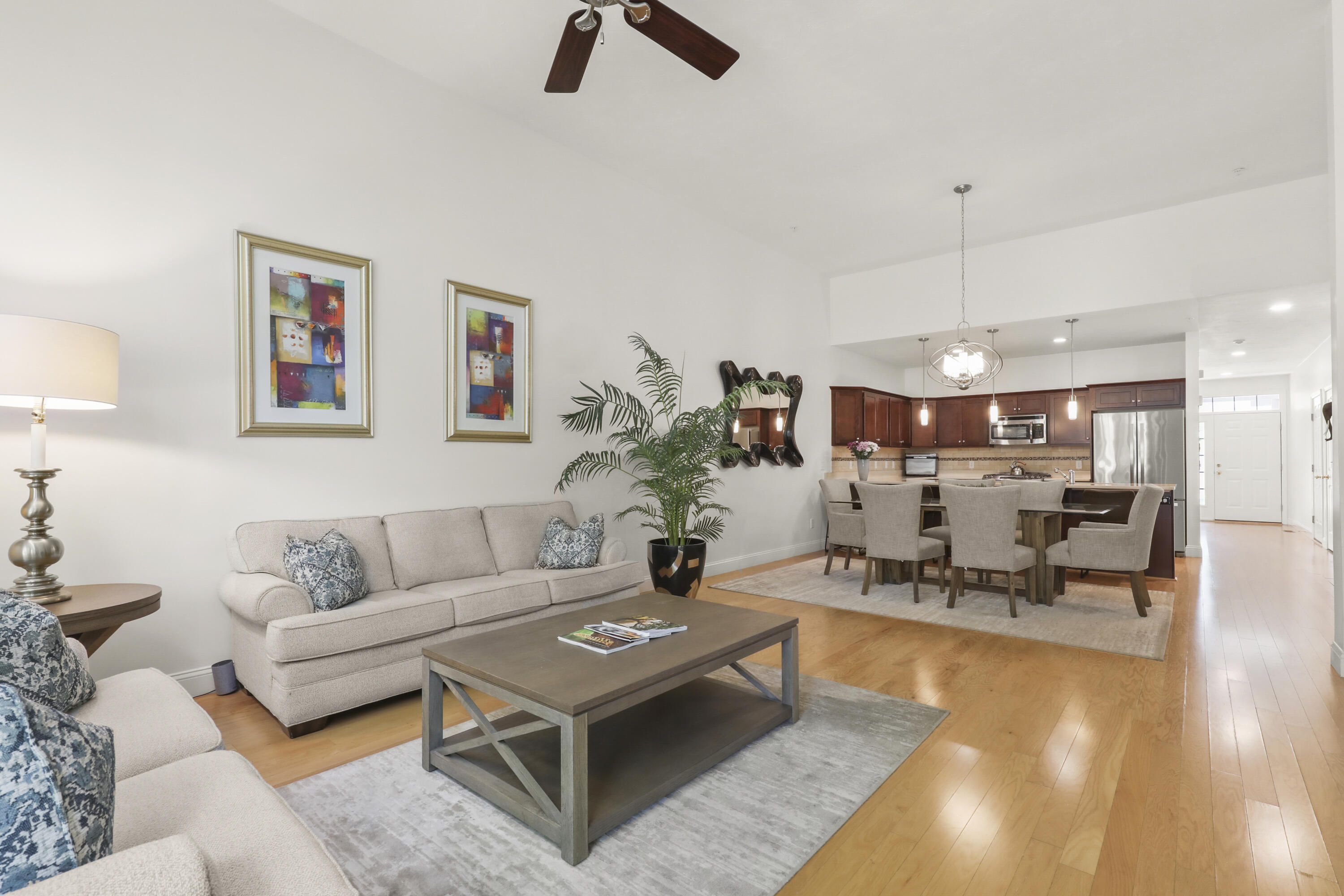 21 Grey Hawk Drive, Unit 21 Mashpee, MA 02649 - Photo 2 of 34 a living room with furniture and a table