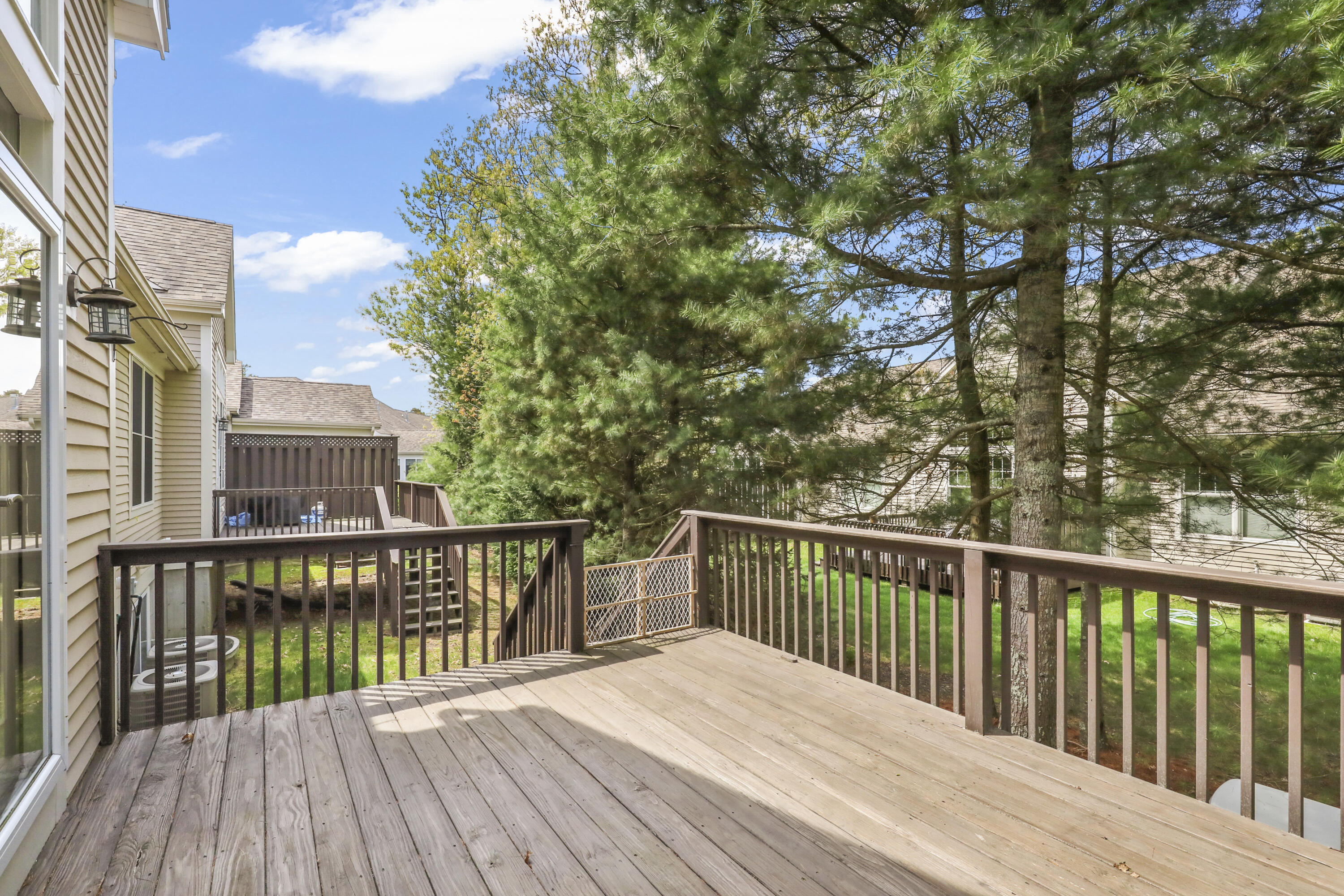 21 Grey Hawk Drive, Unit 21 Mashpee, MA 02649 - Photo 25 of 34 a view of balcony with wooden floor