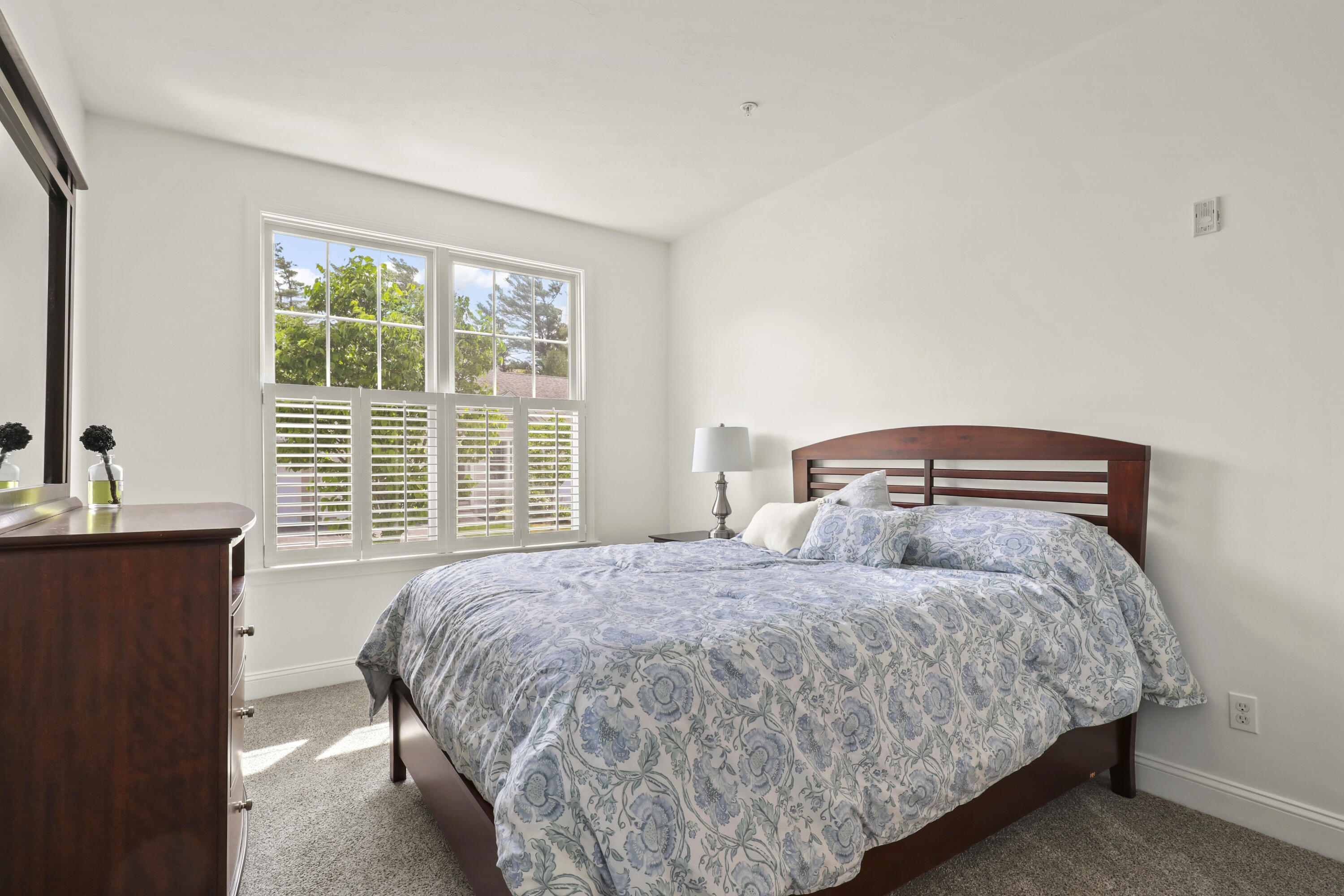 21 Grey Hawk Drive, Unit 21 Mashpee, MA 02649 - Photo 10 of 34 a bedroom with a bed and with windows