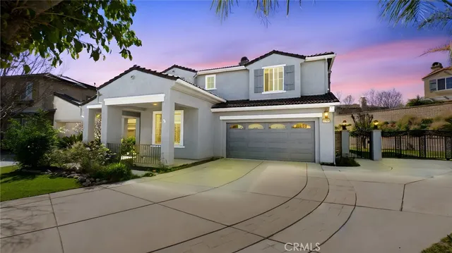 a front view of a house with a garage