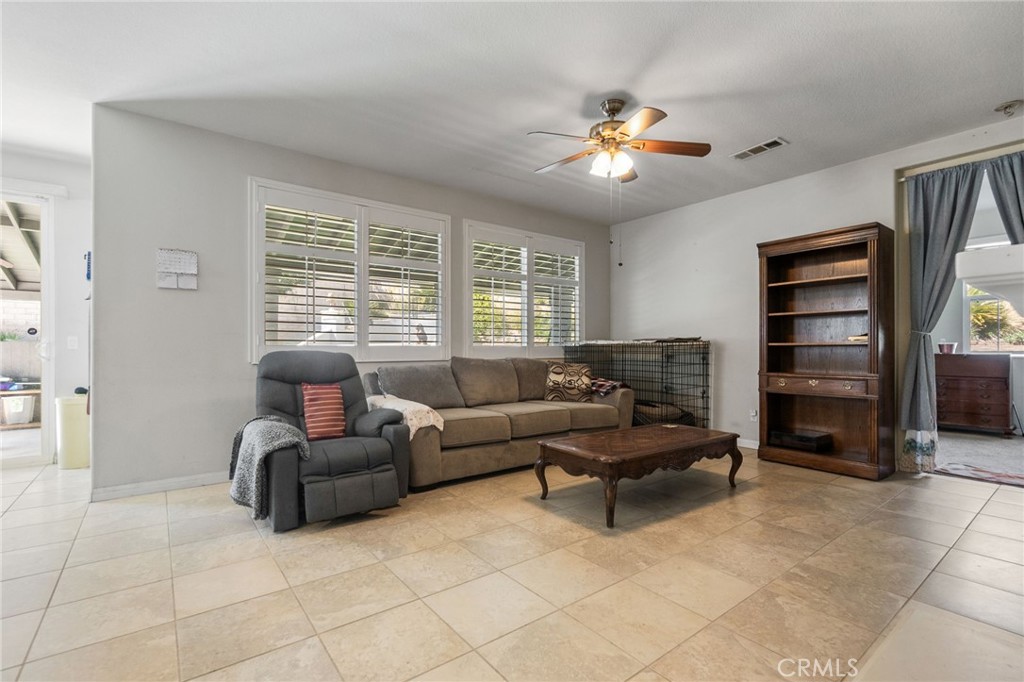 6136 Walnut Grove Court Rancho Cucamonga, CA 91739 - Photo 11 of 41 a living room with furniture and a large window