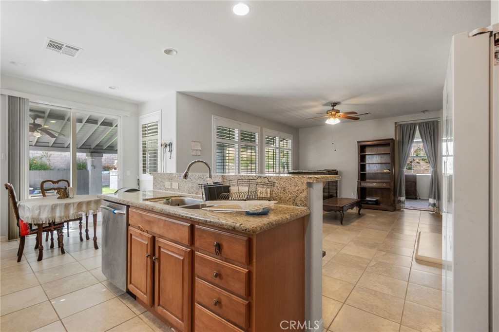 6136 Walnut Grove Court Rancho Cucamonga, CA 91739 - Photo 18 of 41 a kitchen with a sink and cabinets