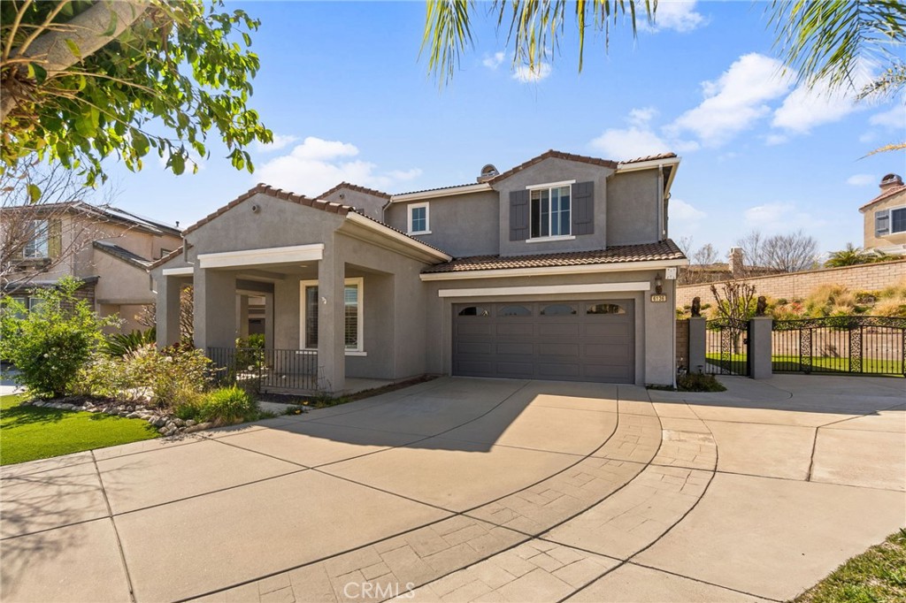 6136 Walnut Grove Court Rancho Cucamonga, CA 91739 - Photo 2 of 41 a view of a house with a yard