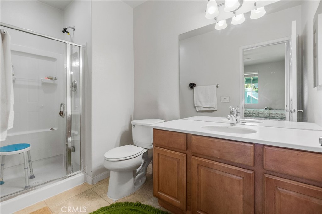 6136 Walnut Grove Court Rancho Cucamonga, CA 91739 - Photo 21 of 41 a bathroom with a sink a toilet and shower
