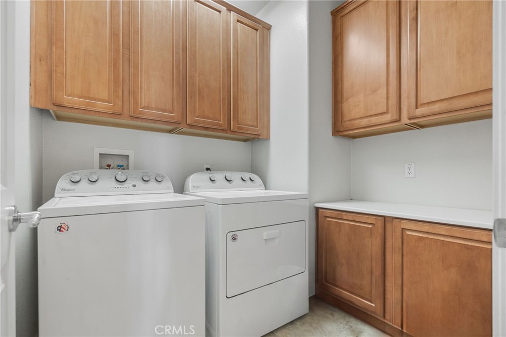 6136 Walnut Grove Court Rancho Cucamonga, CA 91739 - Photo 22 of 41 a utility room with dryer and washer