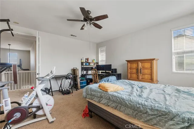 a bedroom with furniture and a window