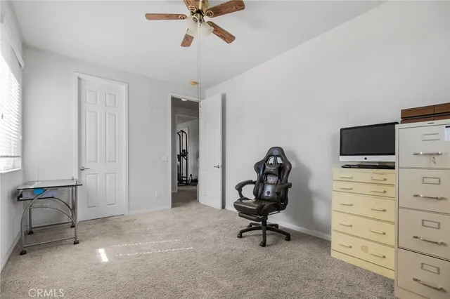 a view of a workspace with furniture