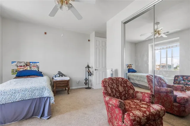 a bedroom with bed and window