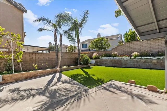a view of a backyard with a swimming pool