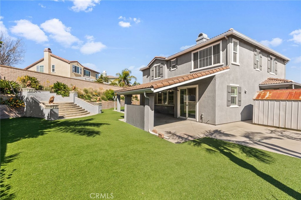 6136 Walnut Grove Court Rancho Cucamonga, CA 91739 - Photo 35 of 41 a front view of a house with a yard