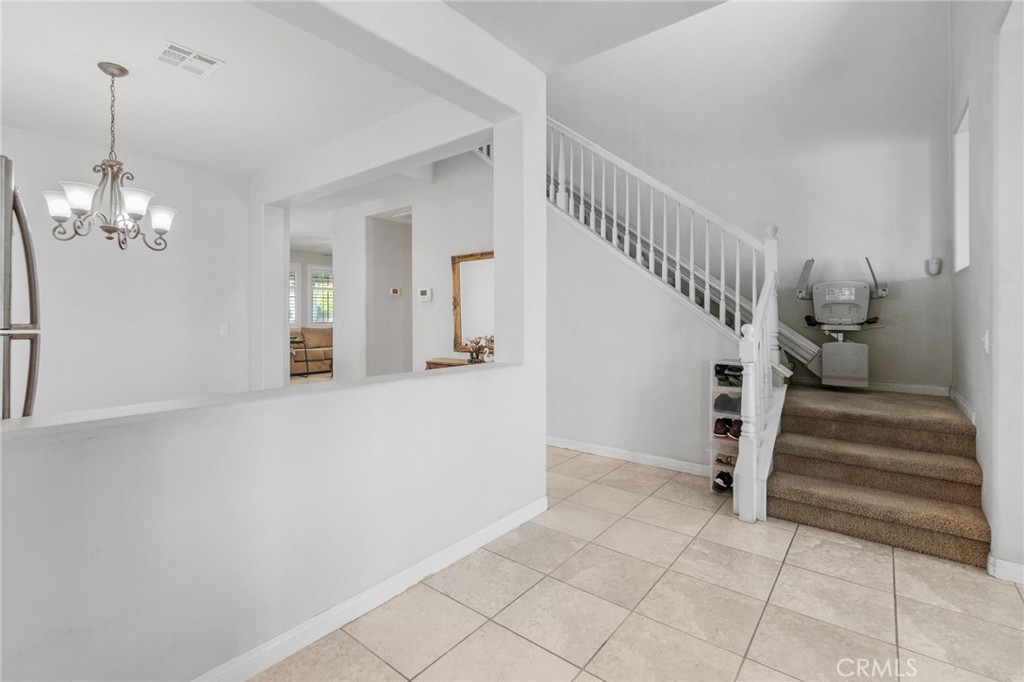 6136 Walnut Grove Court Rancho Cucamonga, CA 91739 - Photo 4 of 41 a view of entryway and hall with a window
