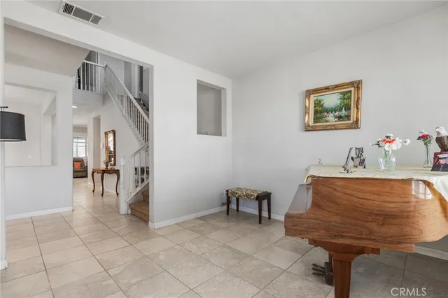 a bed room with a bed and a chair