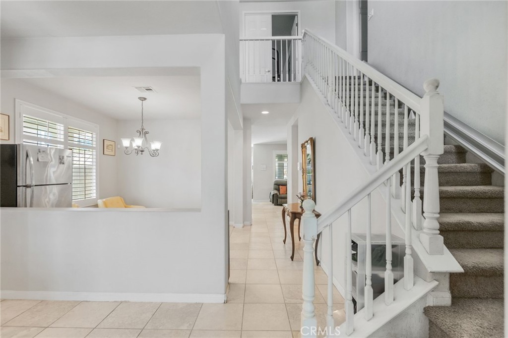 6136 Walnut Grove Court Rancho Cucamonga, CA 91739 - Photo 7 of 41 a view of entryway and hall with wooden floor