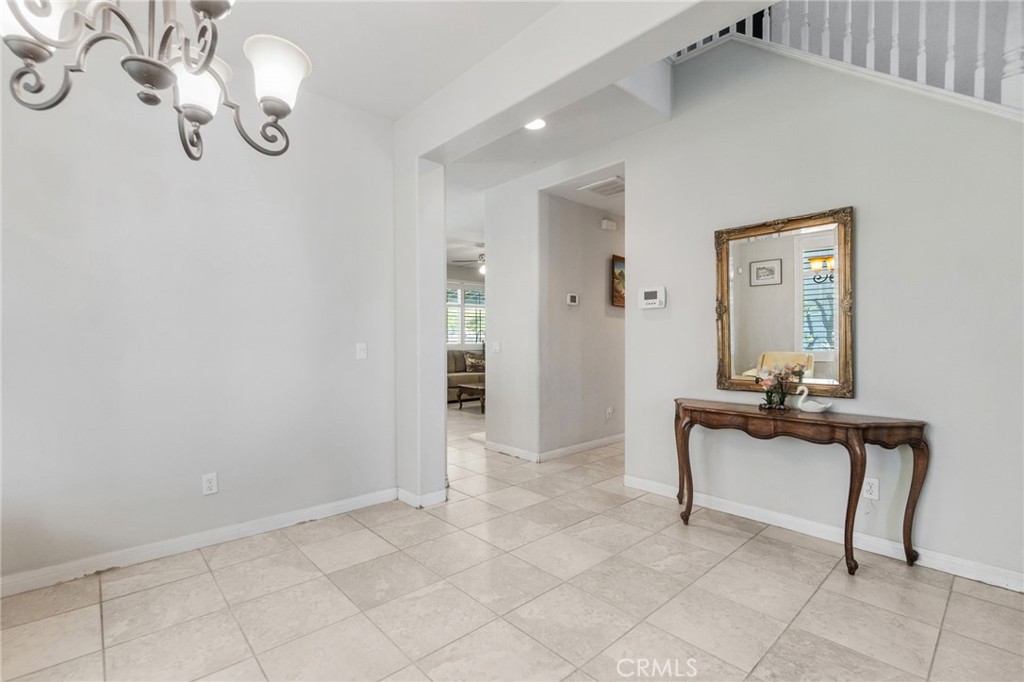 6136 Walnut Grove Court Rancho Cucamonga, CA 91739 - Photo 9 of 41 a view of a livingroom with furniture and chandelier fan