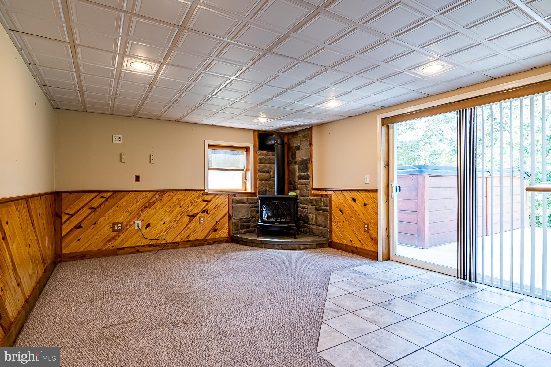 1610 Mill Road Perkasie, PA 18944 - Photo 33 of 61 Family room with free standing propane stove