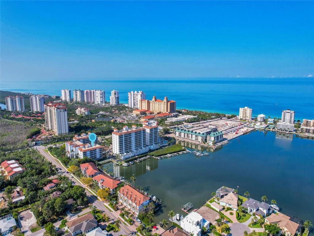 450 Launch Circle, Unit 602 Naples, FL 34108 - Photo 2 of 27 a view of a city and ocean view