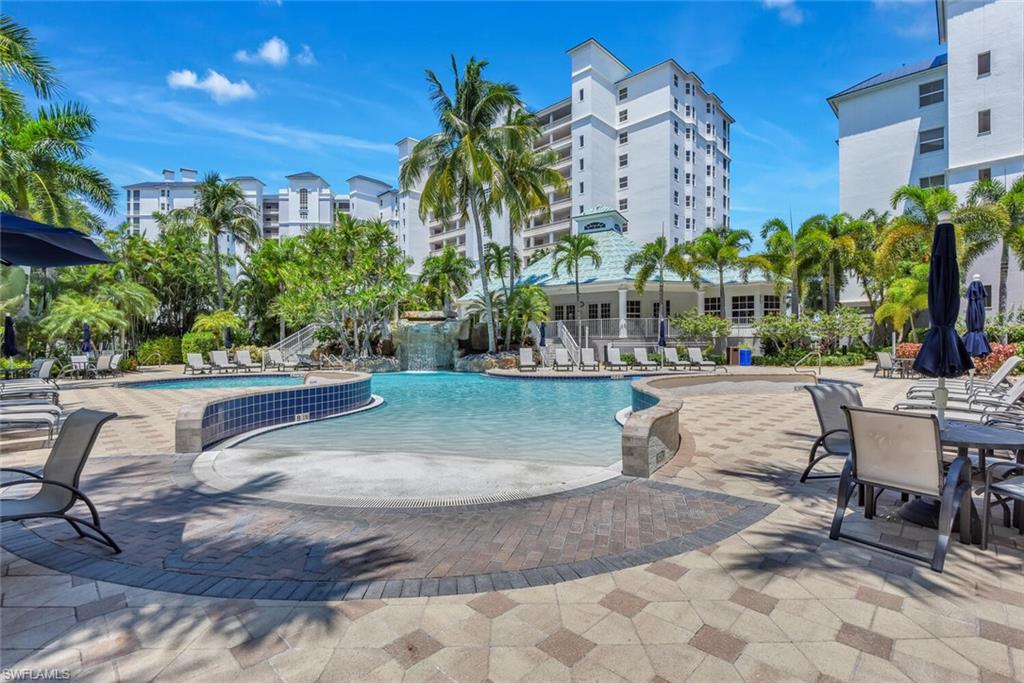 450 Launch Circle, Unit 602 Naples, FL 34108 - Photo 26 of 27 a park with potted plants and large trees