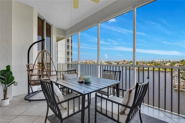 a view of a balcony with furniture