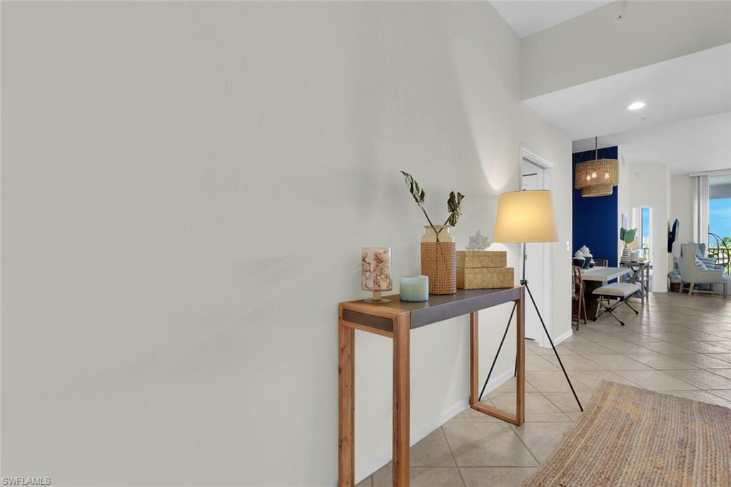 450 Launch Circle, Unit 602 Naples, FL 34108 - Photo 4 of 27 a view of a workspace with furniture and wooden floor