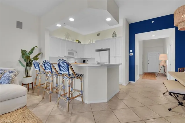 a view of kitchen with furniture and lots of furniture