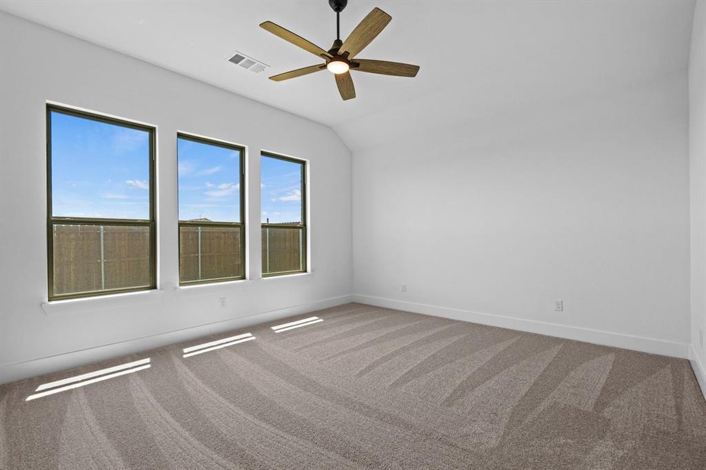 1792 Monarch Way Oak Point, TX 75068 - Photo 15 of 26 an empty room with a window and a fan