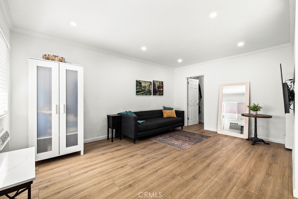 5050 Linden Avenue, Unit 62 Long Beach, CA 90805 - Photo 2 of 37 a living room with furniture and a wooden floor