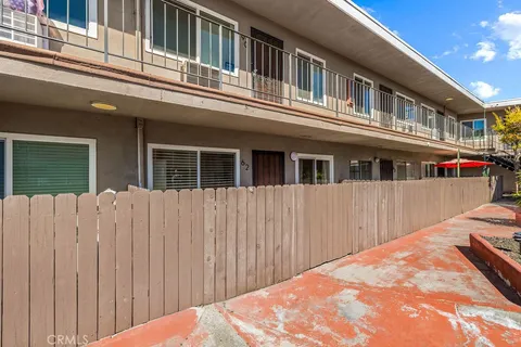 a balcony view with a large window and balcony