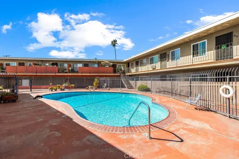 a view of a swimming pool with an outdoor seating