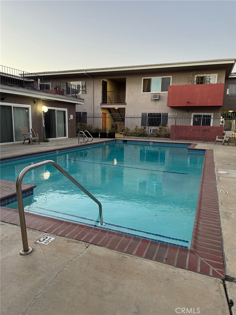 5050 Linden Avenue, Unit 62 Long Beach, CA 90805 - Photo 36 of 37 a view of a house with a swimming pool