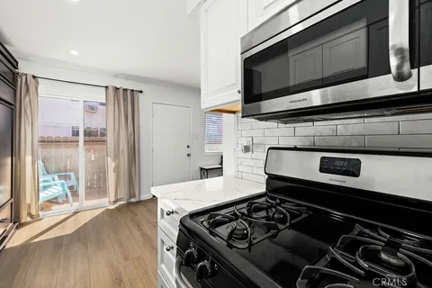 a kitchen with a stove and a microwave