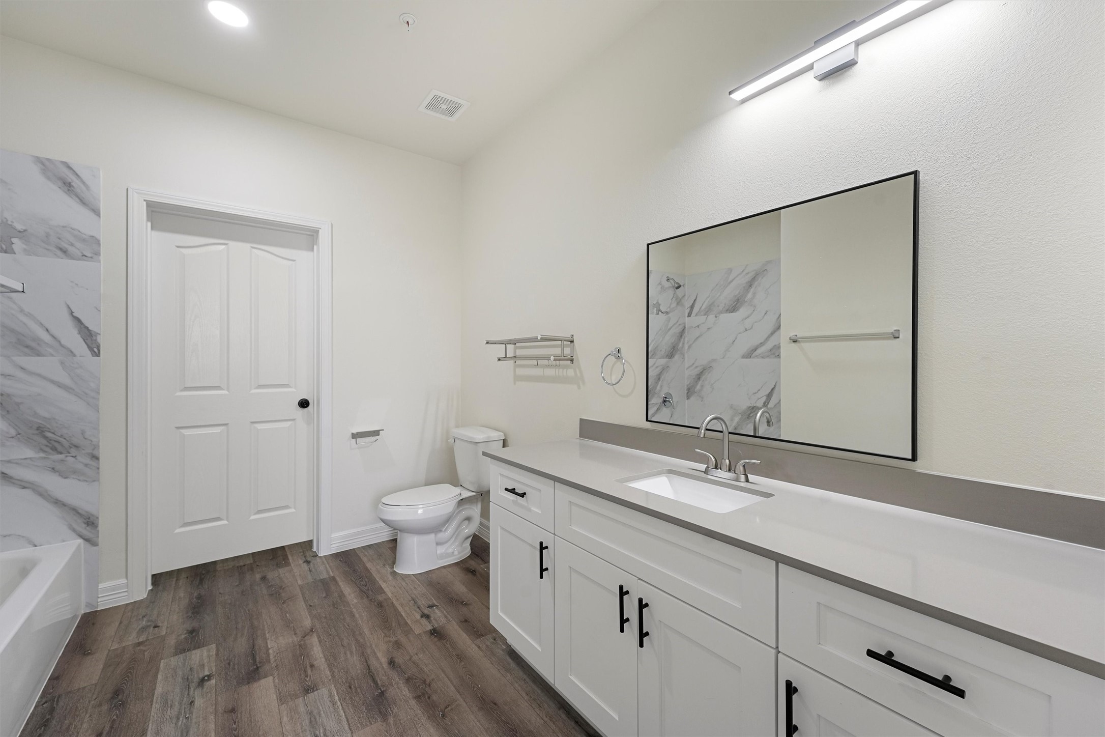 2130 Aldine Mail Rte Road, Unit B102 Houston, TX 77039 - Photo 4 of 9 a bathroom with a toilet a sink and mirror