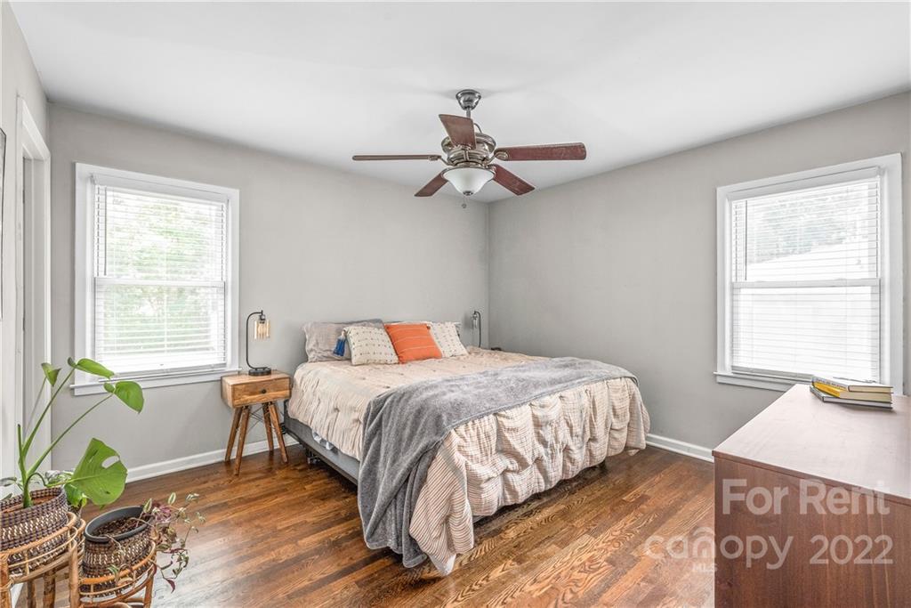 3932 Slagle Drive Charlotte, NC 28215 - Photo 14 of 26 a bedroom with a bed chandelier and a window