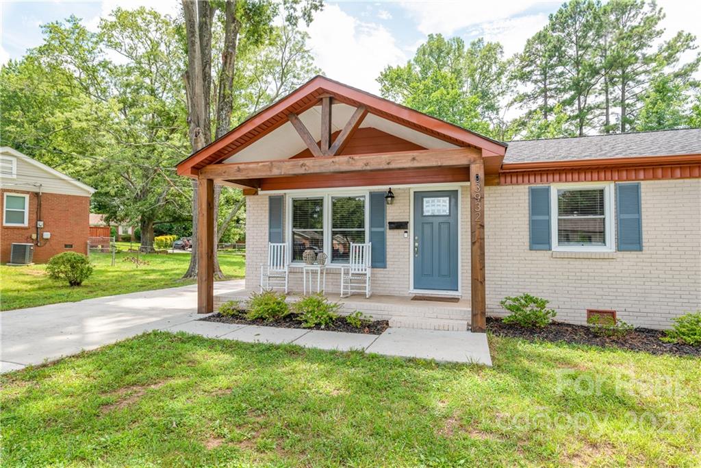 3932 Slagle Drive Charlotte, NC 28215 - Photo 5 of 26 a front view of a house with a yard