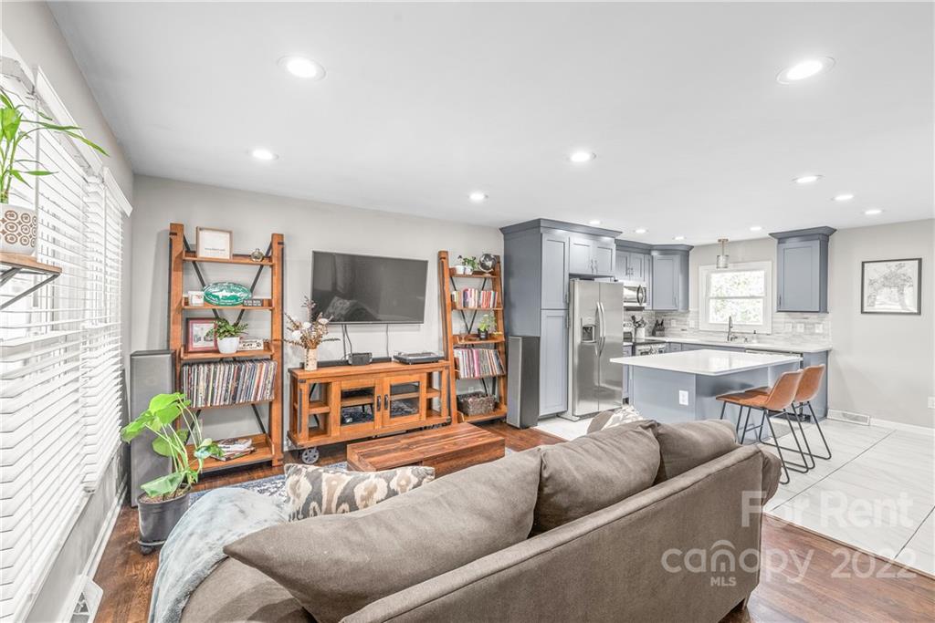 3932 Slagle Drive Charlotte, NC 28215 - Photo 6 of 26 a living room with furniture and a flat screen tv