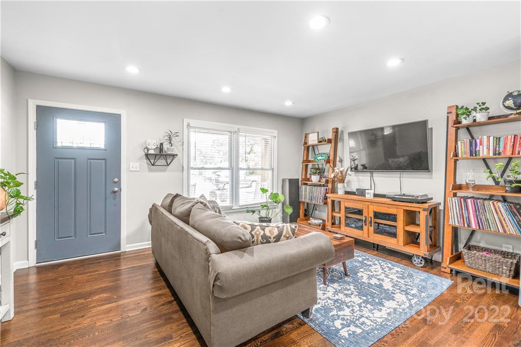 3932 Slagle Drive Charlotte, NC 28215 - Photo 7 of 26 a living room with furniture and a flat screen tv