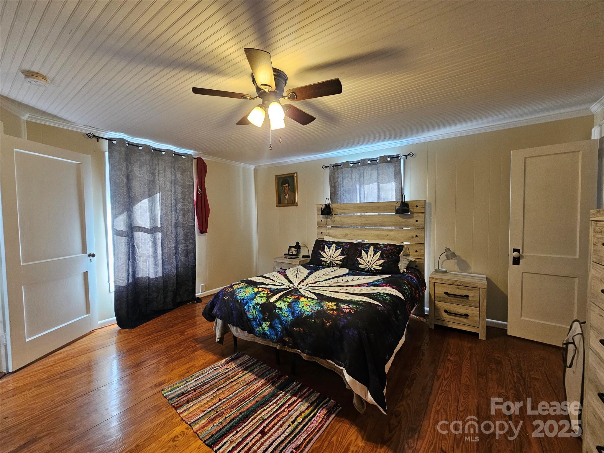 208 West Main Street Lawndale, NC 28090 - Photo 12 of 15 a bedroom with a bed and wooden floor